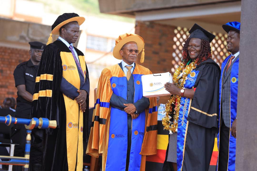 Best graduand receiving an award at the 14th graduation ceremony